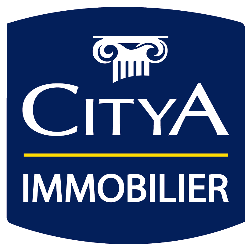 CITYA IMMOBILIER : Logo officiel de l'agence Logo officiel CITYA IMMOBILIER: écusson bleu marine avec inscription blanche. Un chapiteau de colonne grecque stylisé surmonte la marque.